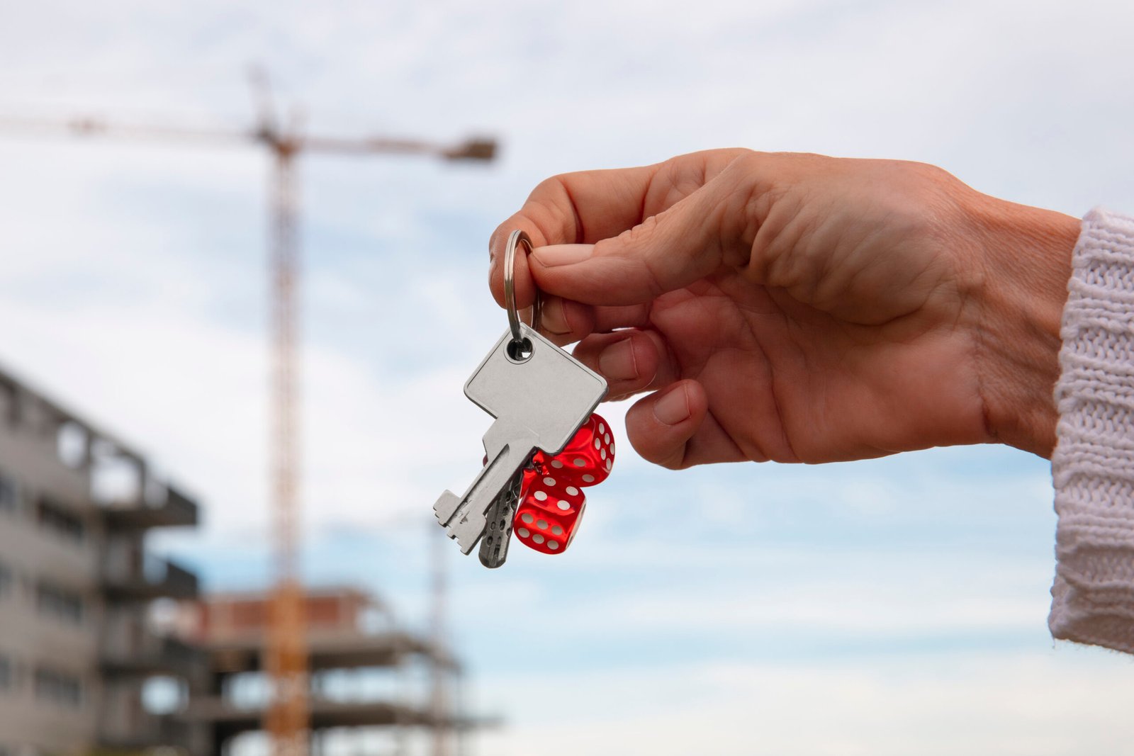hand-holding-keys-outdoors